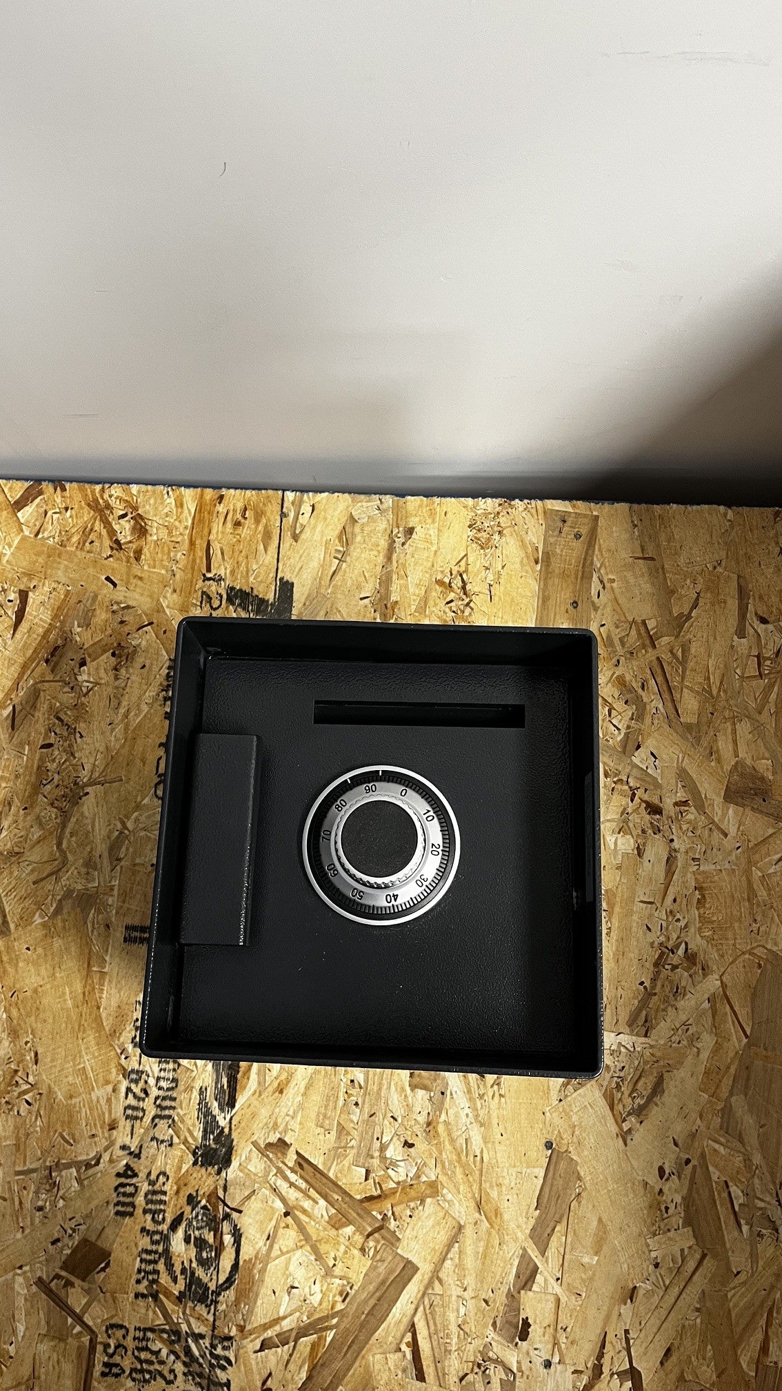 Top view of the safe, it comes with a dial lock. 