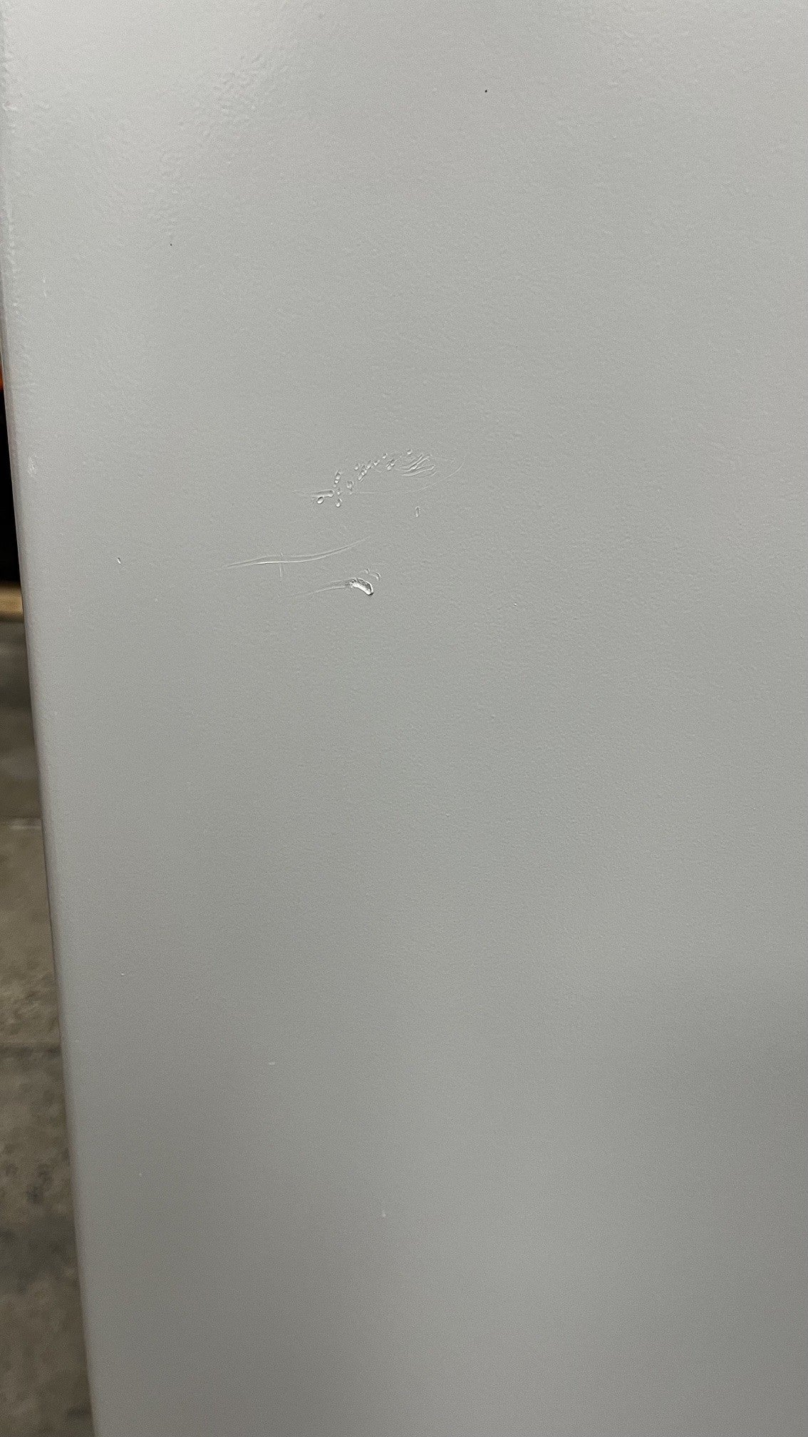 View of small scratches on the right side of the safe. 
