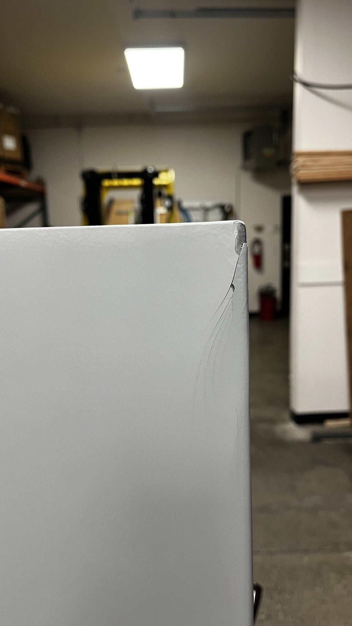 The top corner has a chip on the paint. 
