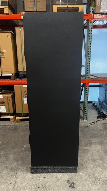 View of the right side of the safe. The top left corner has a chip on the paint. 