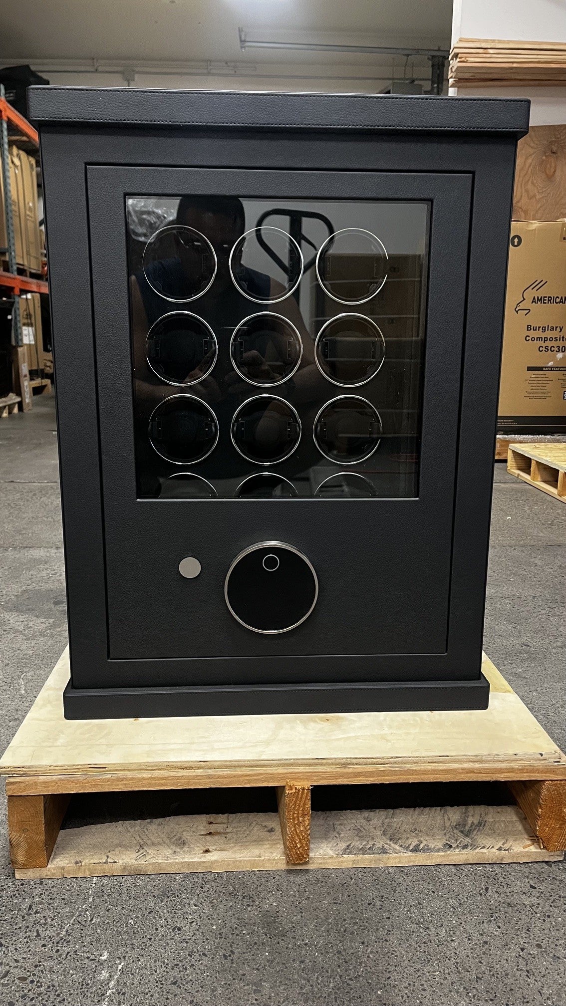 View of the front safe. It has a fingerprint scanner lock with a keypad.  