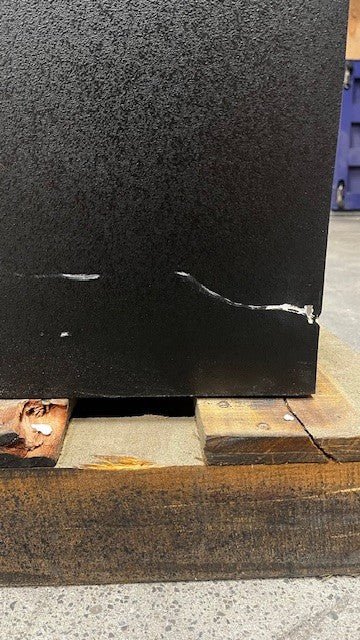 Close-up of the scratches on lower right side of the safe. 