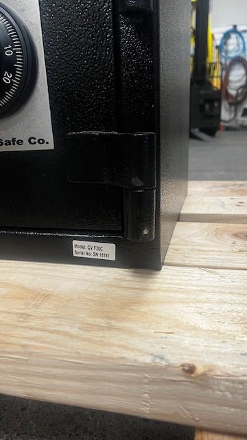 The lower hinge on the safe has a few paint chips. 