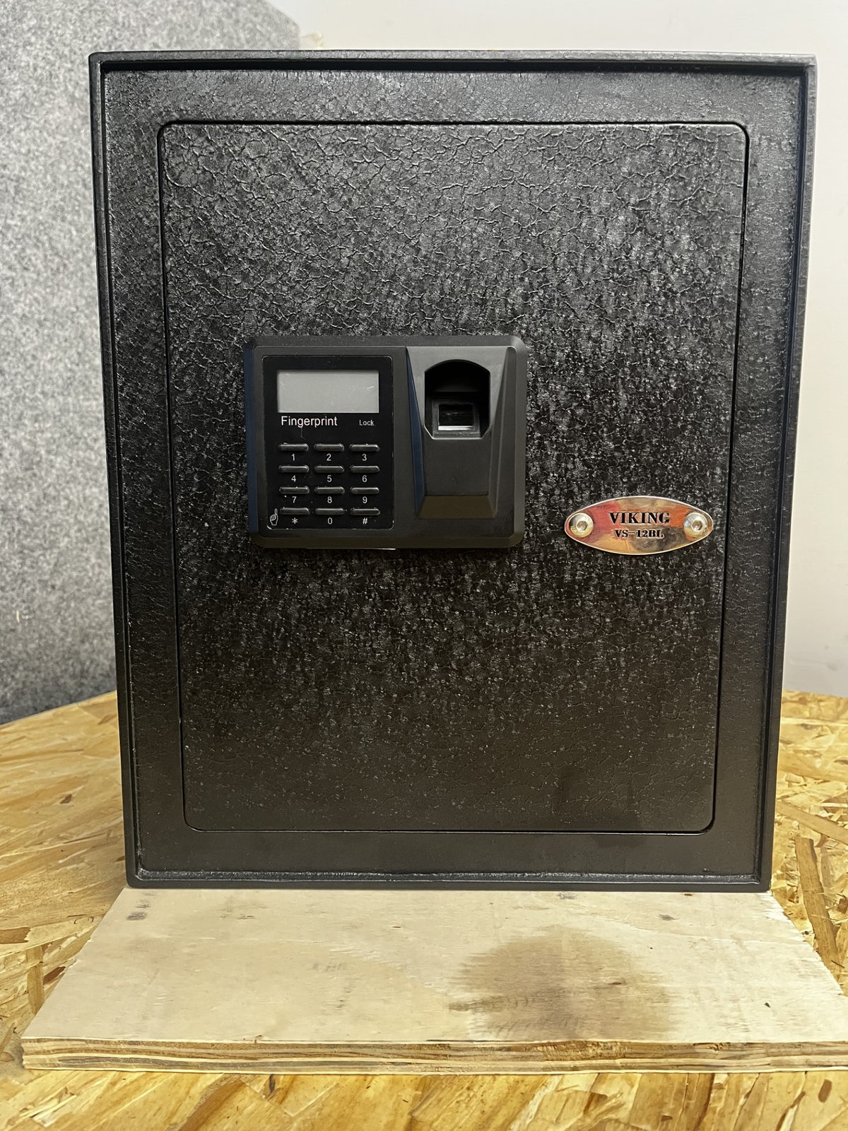 Front view of the safe, it comes with a digital lock with biometric scanner and backup key access. 