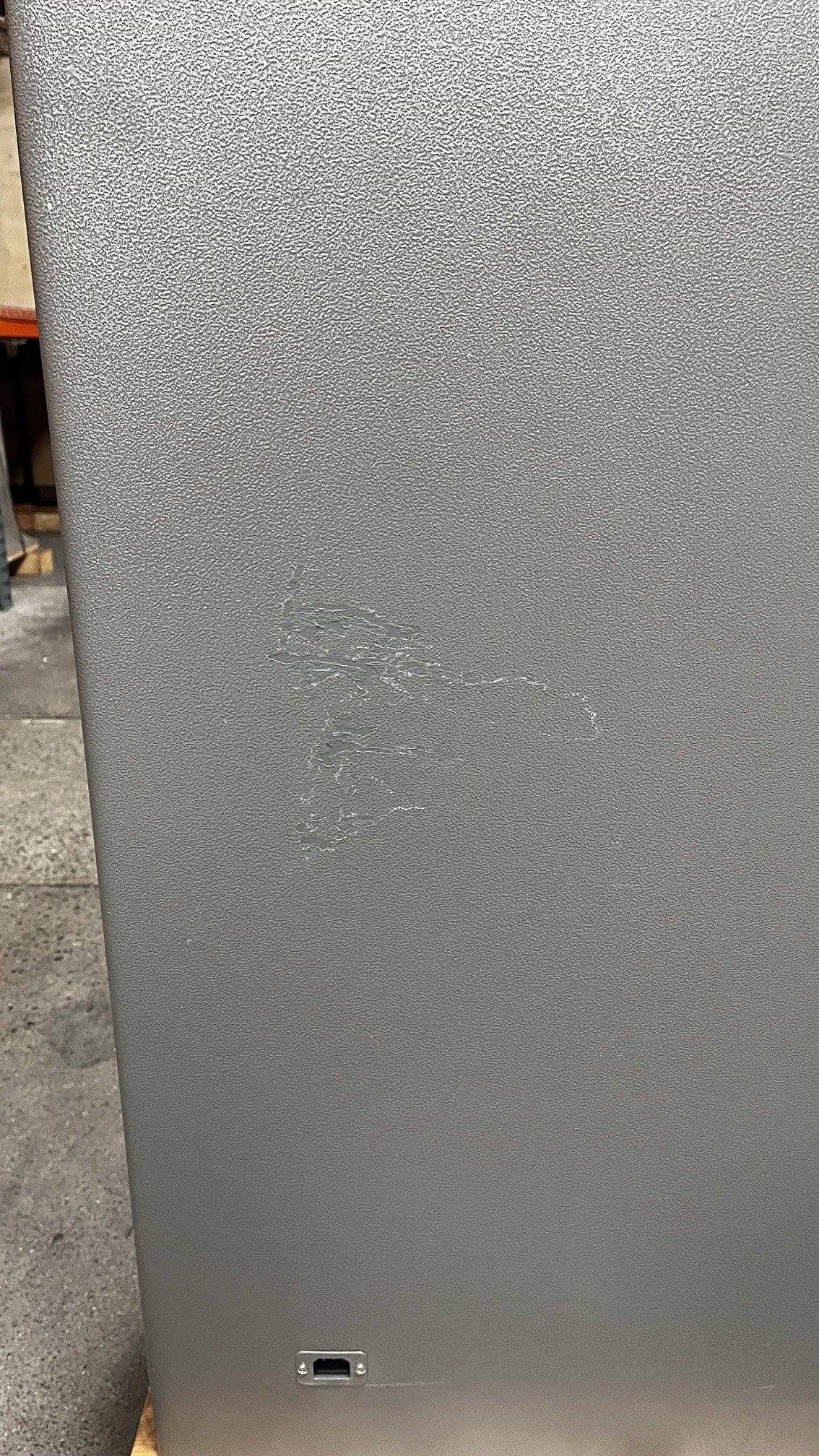 Close-up view of the scratches that are above the power outlet.  