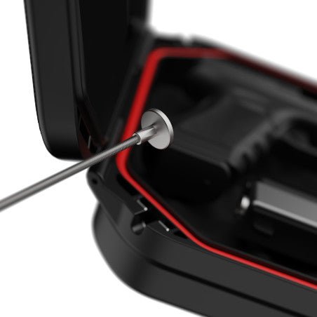 Vaultek LifePod 20 Essential interior showing steel security cable anchored to the attachment point next to a handgun