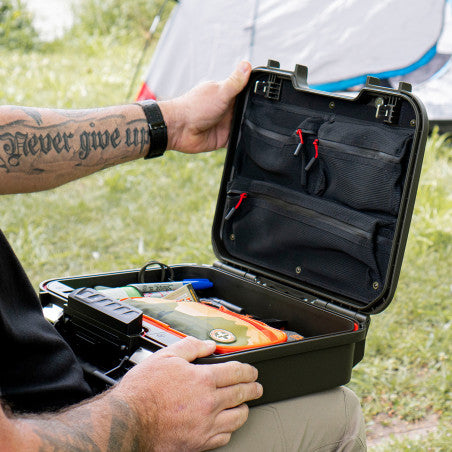 Vaultek XE-ON1 lid organizer installed in a LifePod XE shown open at a campsite with gear inside