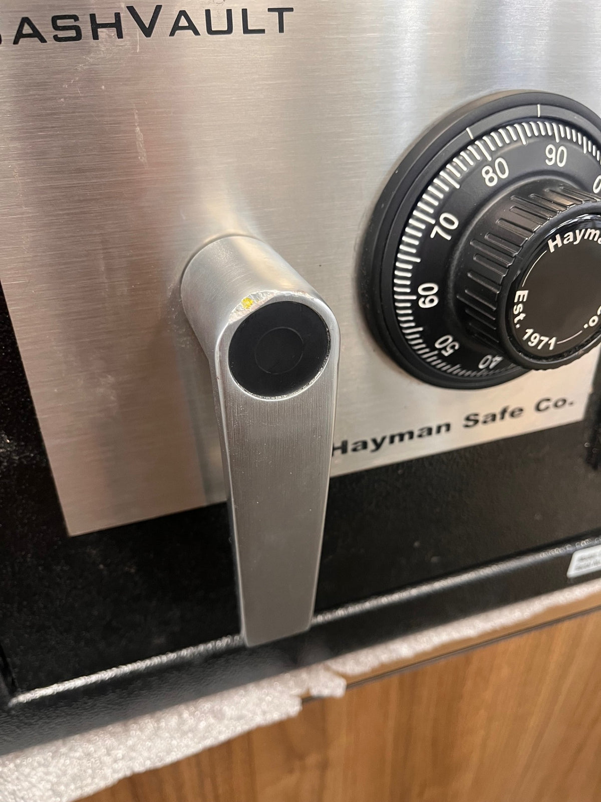 Close-up view of the door handle. It has a chip on the top.