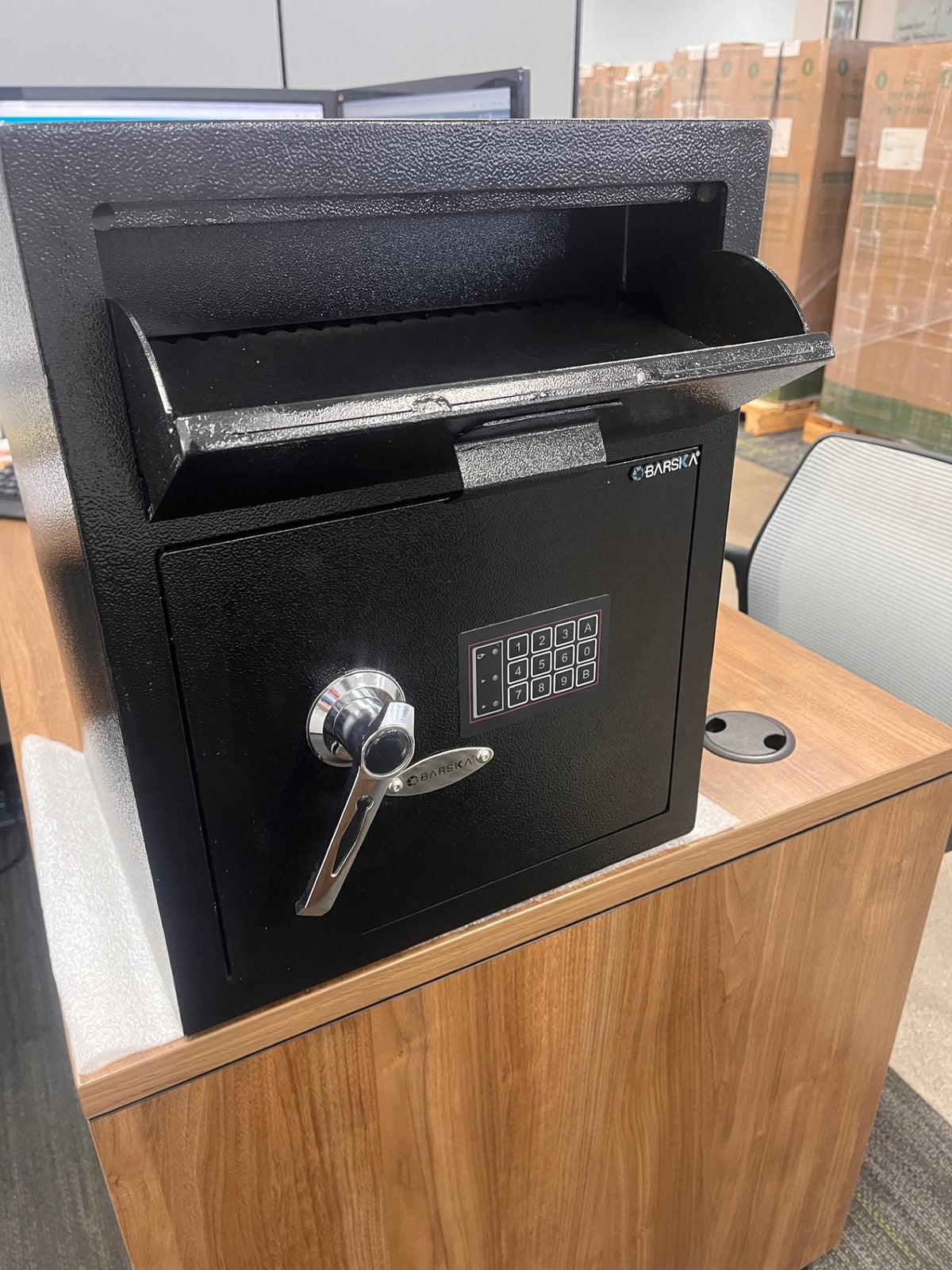 Front view of the safe with the drop shoot open. On the top left corner of the shoot has a very small scratch. 