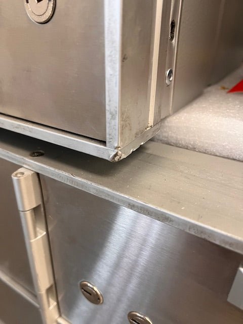 Lower right corner, has a few chips alongside the edge. 