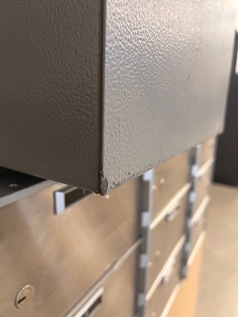 Bottom back right corner has a chip on the paint. 