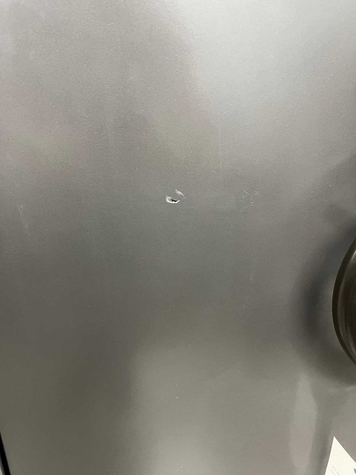 Close-up of a scratch on the safe. 