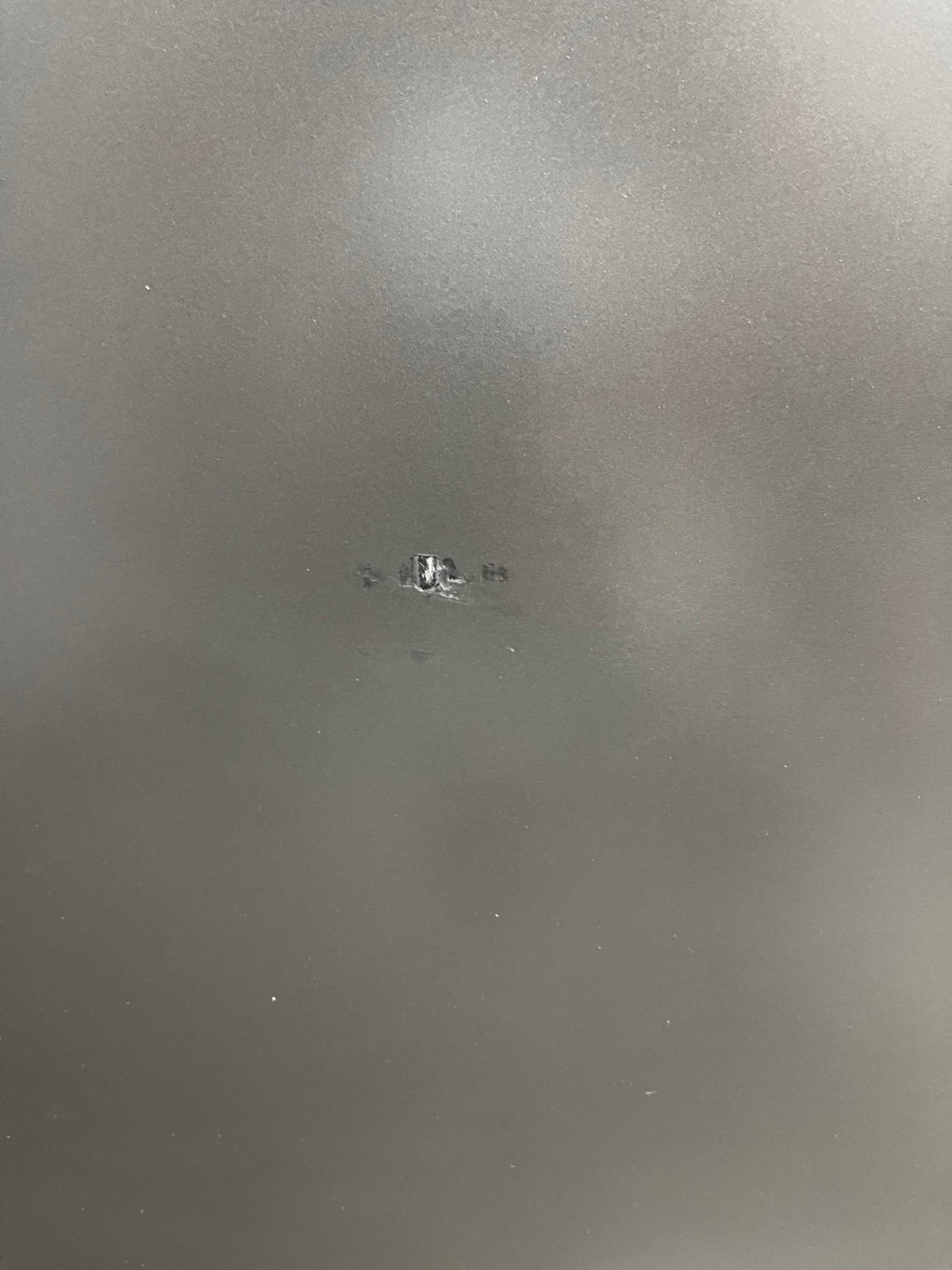 Close-up of a scratch on the left side of the safe. 