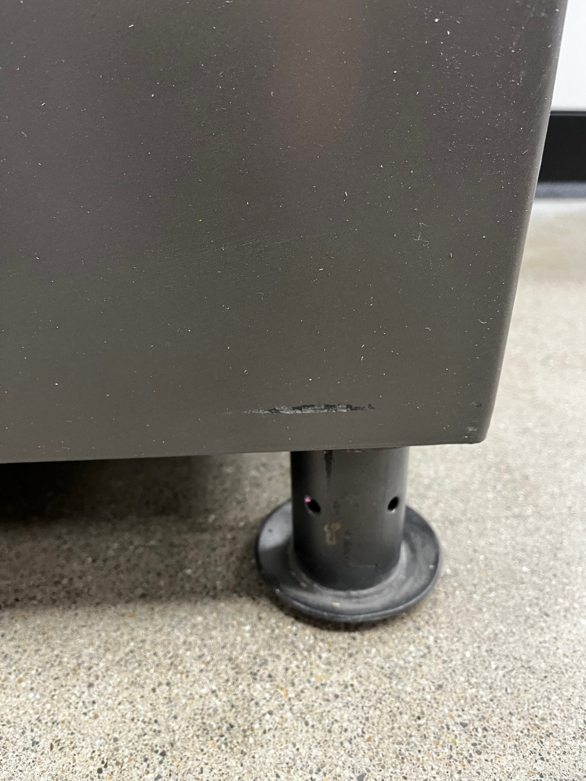 Scratch on the lower left back side of the safe. 