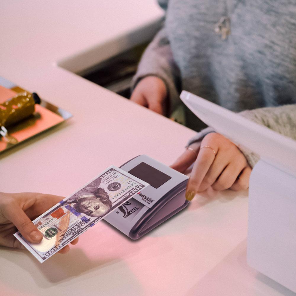 Cassida InstaCheck Automatic Pass/Fail Counterfeit Detector On Counter with $100 Bill