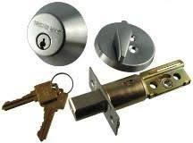 Assorted General Lock D160 626 6WL C Single Cylinder Deadbolt mechanisms and keys isolated on a white background.