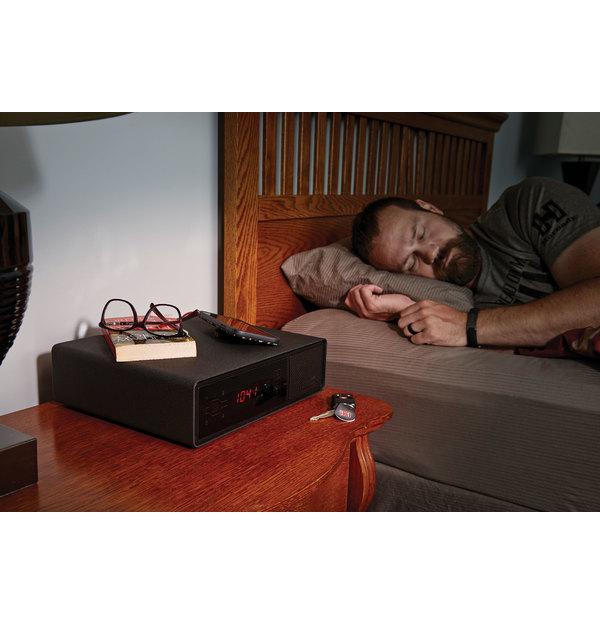 Hornady 98215 Rapid Safe Night Guard Clock Next to Bed with Person Sleeping