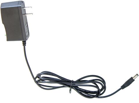 Black Liberty 12592 A/C Adapter with a two-prong plug and a long, coiled cable ending in a round connector, isolated on a white background.