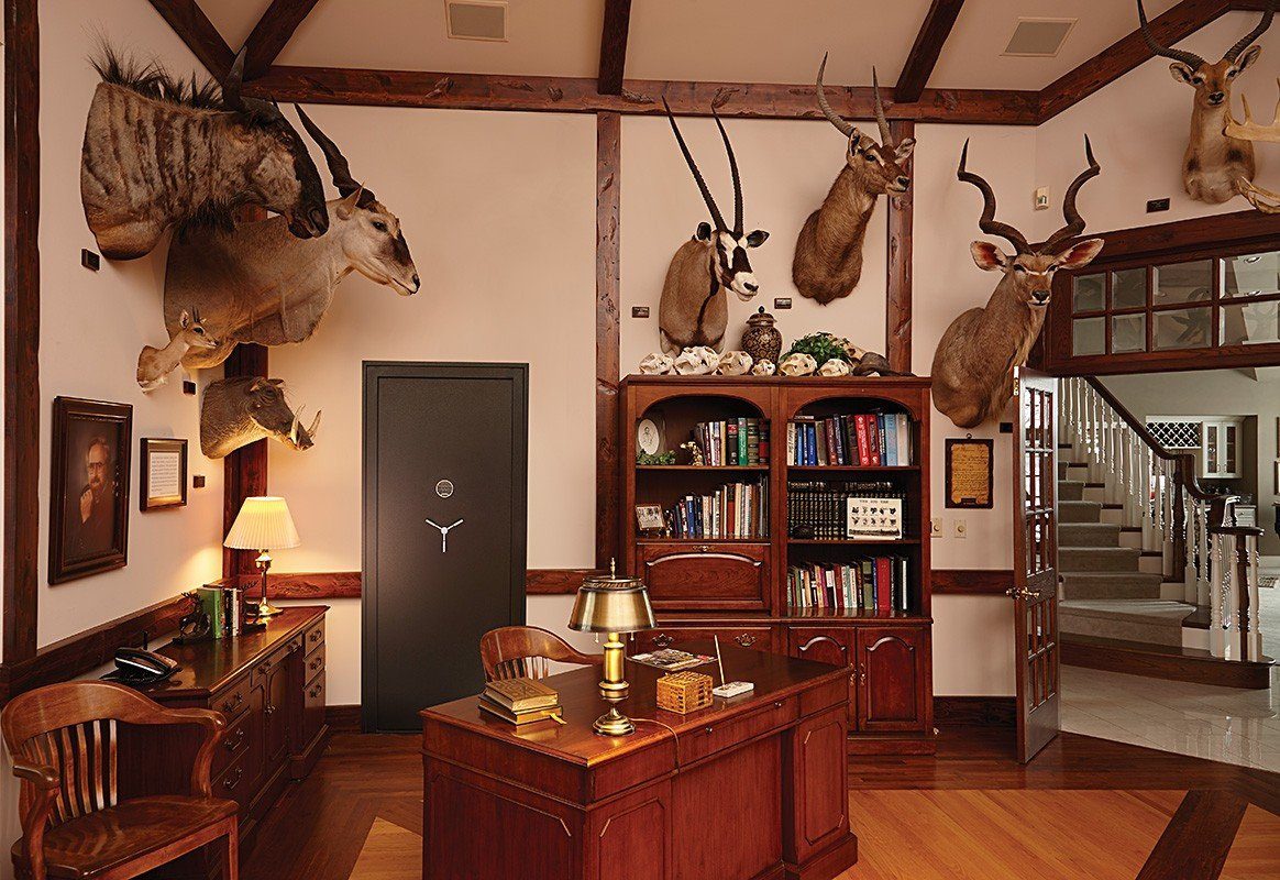 SnapSafe Vault Room Door 36&quot; Installed in Room with Deer Heeds on Wall